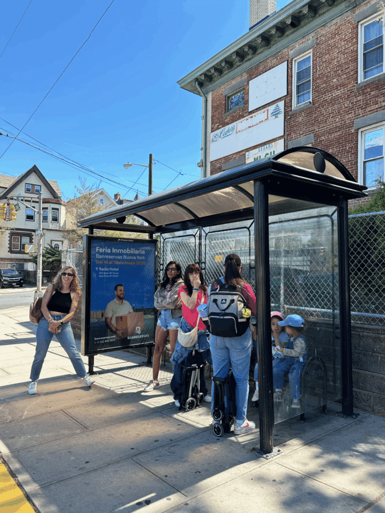Waiting shed banner with people sitting